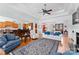 Spacious living room features an open floor plan, seamless flow to the kitchen, and a fireplace at 2477 Peninsula Shores Ct, Denver, NC 28037