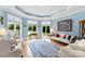 Bright and airy living room featuring large bay windows and stylish, comfortable seating at 2477 Peninsula Shores Ct, Denver, NC 28037