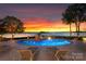 Inviting pool area with a spa and tranquil lake views, perfect for relaxation and outdoor enjoyment at 2477 Peninsula Shores Ct, Denver, NC 28037