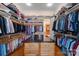 Spacious walk-in closet with custom shelving and storage for clothing and accessories at 2477 Peninsula Shores Ct, Denver, NC 28037