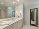 Bright bathroom features a large mirror, vanity, and tiled floors with a shower at 2544 Portland Ave, Charlotte, NC 28207