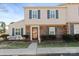 Charming townhome featuring a brick facade, blue shutters, and a well-manicured front yard at 2705 North Center St # 6, Hickory, NC 28601