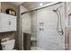 Modern shower with glass doors, tile walls, a built-in seat, and sleek showerhead fixtures at 2705 North Center St # 6, Hickory, NC 28601