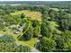 An aerial view displays the layout of the property, showing the ample lot and lush surrounding landscape at 28419 Nc Hwy 73 Hwy, Albemarle, NC 28001