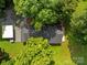 Aerial view of a lovely home with mature trees, well-kept lawn, and a detached garage at 28419 Nc Hwy 73 Hwy, Albemarle, NC 28001