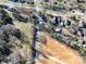 Aerial view of a neighborhood with homes, driveways, and open space at 28419 Nc Hwy 73 Hwy, Albemarle, NC 28001
