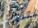 Aerial view of the property showcasing a cluster of homes along a street in a rural environment at 28419 Nc Hwy 73 Hwy, Albemarle, NC 28001