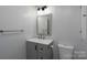 Modern bathroom with a gray vanity, new toilet, and neutral walls at 28419 Nc Hwy 73 Hwy, Albemarle, NC 28001