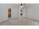 Bedroom with carpet, neutral walls, closet and view of the kitchen at 28419 Nc Hwy 73 Hwy, Albemarle, NC 28001