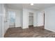 Bedroom featuring wood floors, closet, bathroom, and a light paint scheme at 28419 Nc Hwy 73 Hwy, Albemarle, NC 28001