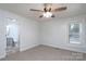 Cozy bedroom with neutral carpeting, natural light, and adjacent bathroom at 28419 Nc Hwy 73 Hwy, Albemarle, NC 28001