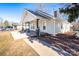 Exterior angle showcasing a charming home with a welcoming front porch and a well-maintained lawn at 28419 Nc Hwy 73 Hwy, Albemarle, NC 28001