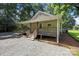 Charming home featuring a cozy front porch, gravel driveway, and well-maintained landscaping at 28419 Nc Hwy 73 Hwy, Albemarle, NC 28001