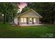 Charming single-story home featuring a welcoming front porch, manicured lawn, and mature trees at 28419 Nc Hwy 73 Hwy, Albemarle, NC 28001