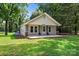 Charming single-story home featuring a welcoming front porch, manicured lawn, and mature trees at 28419 Nc Hwy 73 Hwy, Albemarle, NC 28001