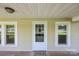 A well lit covered front porch with detailed front door at 28419 Nc Hwy 73 Hwy, Albemarle, NC 28001