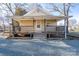 Attractive home with a covered front porch, wooden railings, and steps leading to the entrance at 28419 Nc Hwy 73 Hwy, Albemarle, NC 28001