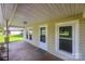 A well lit covered front porch with detailed front door at 28419 Nc Hwy 73 Hwy, Albemarle, NC 28001