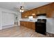 Bright kitchen with white subway tile backsplash, wood cabinets, and black appliances at 28419 Nc Hwy 73 Hwy, Albemarle, NC 28001