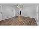 Bright living room with wood-look floors, neutral walls, and a ceiling fan at 28419 Nc Hwy 73 Hwy, Albemarle, NC 28001