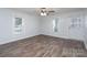 Bright living room featuring wood-look flooring, neutral walls, and a modern ceiling fan for comfortable living at 28419 Nc Hwy 73 Hwy, Albemarle, NC 28001