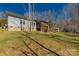 View of a backyard with green grass, a patio, and a shed on a lot with sparse woods at 2925 Anderson Burgess Rd, Sharon, SC 29742