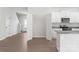 Well-lit kitchen area with white cabinetry, stainless steel appliances, and a convenient pantry at 3358 Burberry Dr, Gastonia, NC 28052