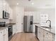 Modern kitchen with stainless steel appliances, granite countertops, and ample cabinet space at 3358 Burberry Dr, Gastonia, NC 28052