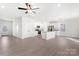 Open-concept design showcasing the living room, kitchen with island, and ample natural light at 3358 Burberry Dr, Gastonia, NC 28052