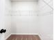 An empty walk-in closet features metal storage racks and neutral colored carpet at 3430 Saddlebred Dr, Gastonia, NC 28052