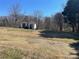 Spacious backyard with storage sheds, providing ample space for outdoor activities at 3481 Roberta Rd, Concord, NC 28027