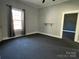 Cozy bedroom with neutral walls, window with natural light, and closet for storage at 3481 Roberta Rd, Concord, NC 28027