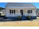 Charming single-story home with inviting front porch and meticulously maintained front lawn at 3481 Roberta Rd, Concord, NC 28027
