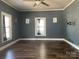 Spacious living room featuring updated flooring, neutral wall color, and plenty of natural light at 3481 Roberta Rd, Concord, NC 28027