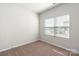 Bedroom featuring neutral carpet and a window with blinds at 3527 Clover Valley Dr, Gastonia, NC 28052