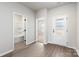 Bright entryway featuring wood-look flooring and doorways to the bathroom and a bedroom at 3527 Clover Valley Dr, Gastonia, NC 28052