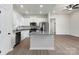 Well-lit kitchen showcasing white cabinetry, granite countertops, and stainless steel appliances at 3527 Clover Valley Dr, Gastonia, NC 28052