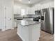 Modern kitchen featuring white cabinets, granite countertops, and stainless steel appliances at 3527 Clover Valley Dr, Gastonia, NC 28052