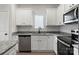 Charming kitchen with granite countertops, stainless steel appliances, and white cabinets at 3527 Clover Valley Dr, Gastonia, NC 28052