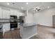 Bright kitchen with stainless steel appliances, granite countertops, and a central island, creating a chef-friendly space at 3606 Clover Valley Dr, Gastonia, NC 28052