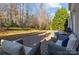 Backyard patio with seating and a storage shed surrounded by mature trees at 437 Buttermere Rd # 31, Fort Mill, SC 29715