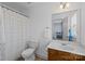Bathroom featuring a sink vanity, tiled floors, a shower, and a large mirror at 437 Buttermere Rd # 31, Fort Mill, SC 29715