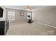 Spacious bedroom with ceiling fan, carpet, and exercise bike at 437 Buttermere Rd # 31, Fort Mill, SC 29715