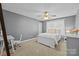 Charming bedroom featuring neutral walls, white furniture, a ceiling fan, and natural light at 437 Buttermere Rd # 31, Fort Mill, SC 29715