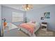 Bedroom featuring blue accent walls, a ceiling fan, white furnishings, and natural light at 437 Buttermere Rd # 31, Fort Mill, SC 29715