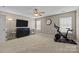 Spacious bedroom with ceiling fan, large television, exercise bike, and neutral carpet at 437 Buttermere Rd # 31, Fort Mill, SC 29715