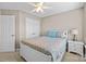 Cozy bedroom featuring beige walls, white trim, a ceiling fan, and natural light at 437 Buttermere Rd # 31, Fort Mill, SC 29715