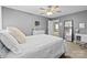 Cozy bedroom featuring neutral walls, white furniture, a ceiling fan, and large mirrors at 437 Buttermere Rd # 31, Fort Mill, SC 29715