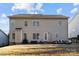 Exterior elevation of the back of a large home with patio and seating area at 437 Buttermere Rd # 31, Fort Mill, SC 29715