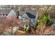 Inviting two-story home featuring a mix of stone and brick, complemented by a landscaped front yard and covered porch at 437 Buttermere Rd # 31, Fort Mill, SC 29715